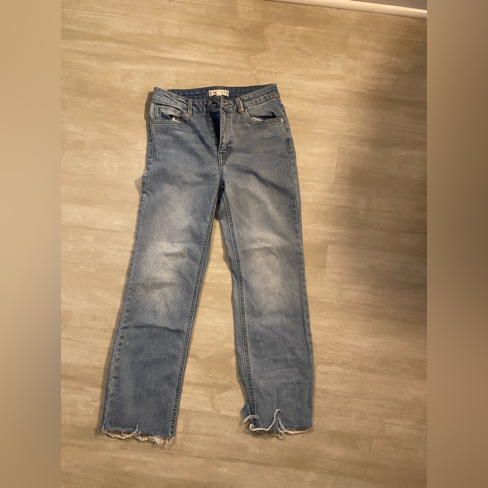 Francesca’s straight leg, medium/light wash jeans with slight distressing